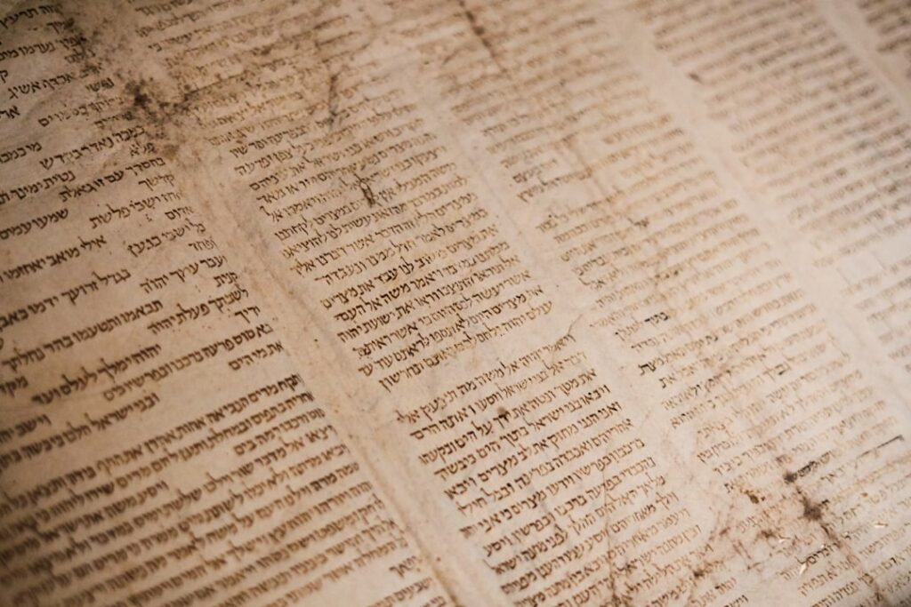 Open ancient manuscript used for historical study of sacred texts