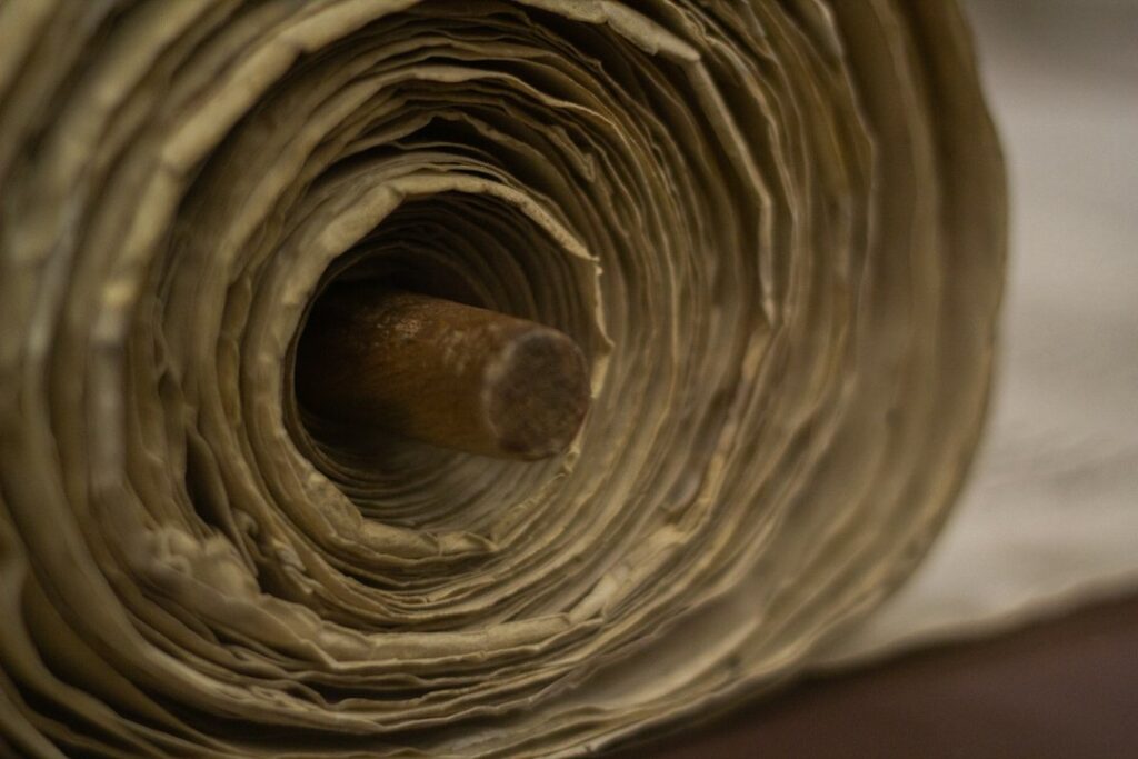 Close view of an ancient Torah scroll related to Abrahamic tradition