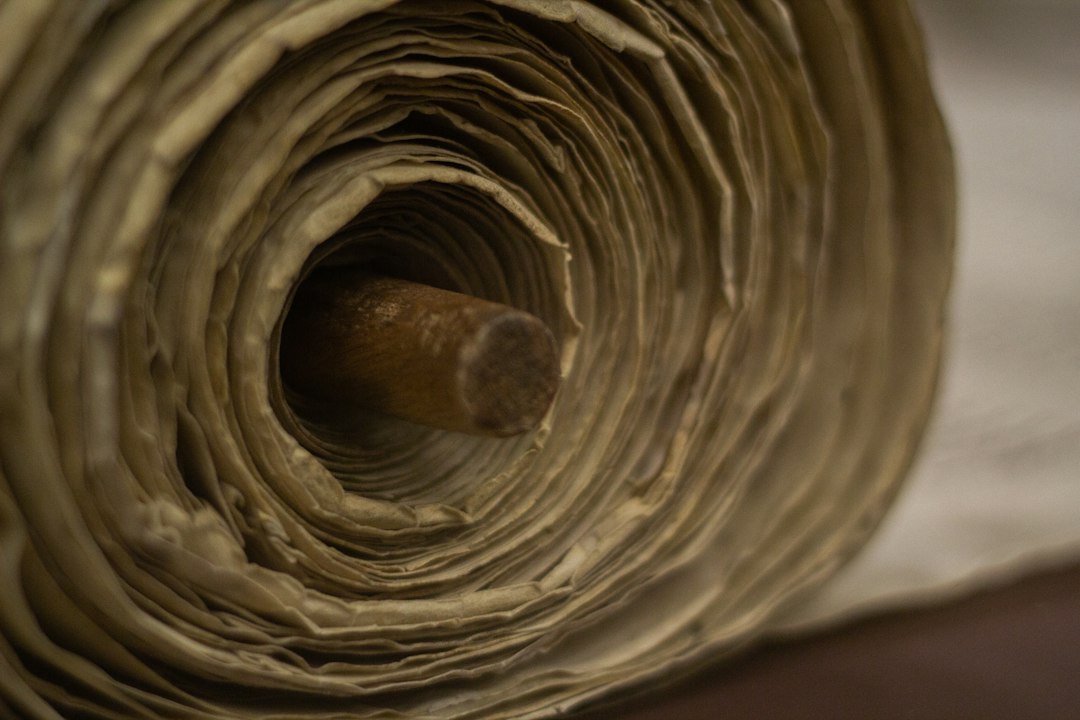 Close view of an ancient Torah scroll related to Abrahamic tradition